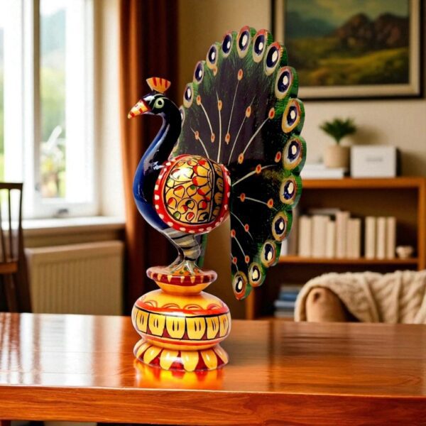 Wooden hand painted peacock with multicolor on a table top