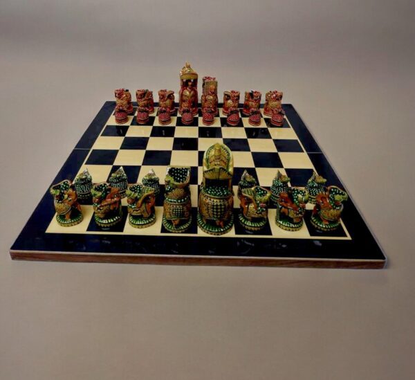 wooden hand painted chess pieces red green color on chess board