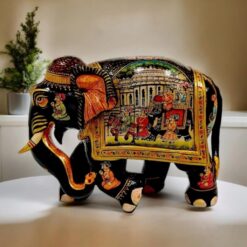 Rajasthani royal painting with black gold color theme and royal king Sawari painted on elephant.