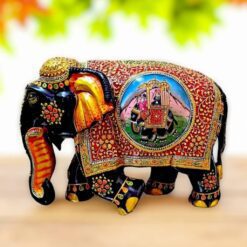 wooden elephant painted with flower design and Ambari elephant painted on it.