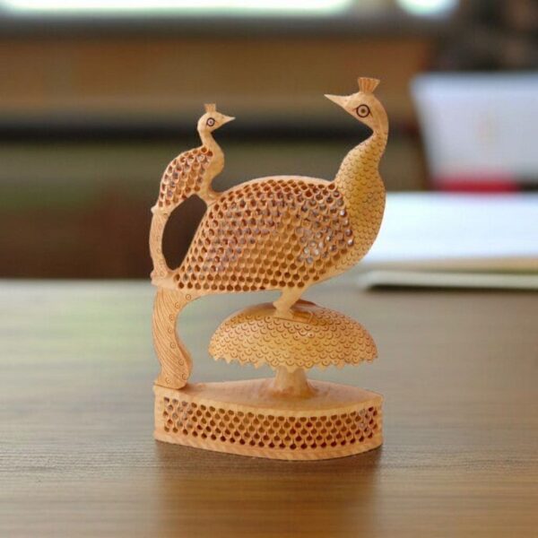 wooden jali peacock with baby on a wood base