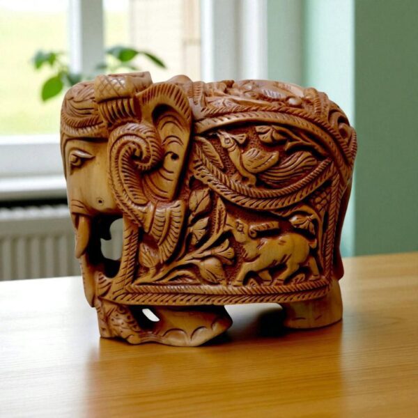 sandalwood elephant with hand-carved deer and peacock on it