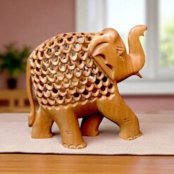 handcrafted sandalwood elephant statue jalee work setting on a table