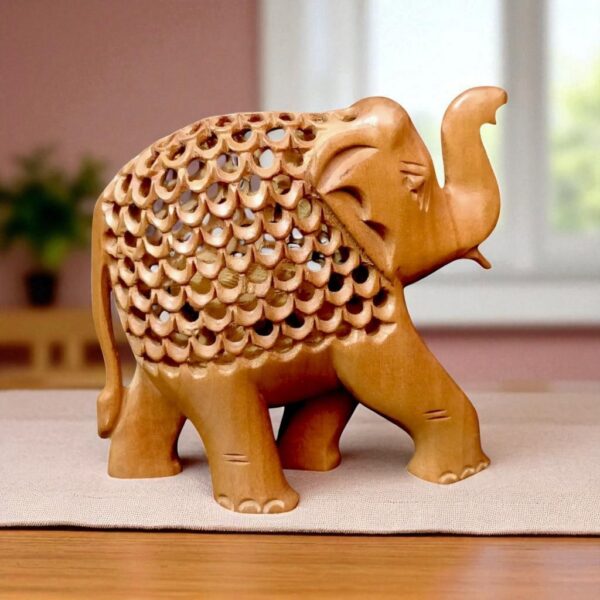 handcrafted sandalwood elephant statue jalee work setting on a table
