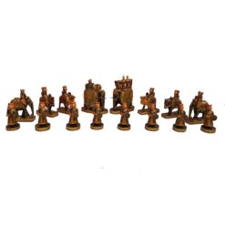 Intricately carved Indian-inspired painted chess set with gold accents and ornate cultural designs.