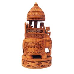 Wood carving of Rajasthan royal elephant with ornate howdah and carved base.
