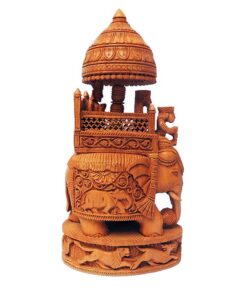 Wood carving of Rajasthan royal elephant with ornate howdah and carved base.