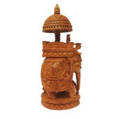 Wooden carved elephant with Ambari canopy and ornate ceremonial details.