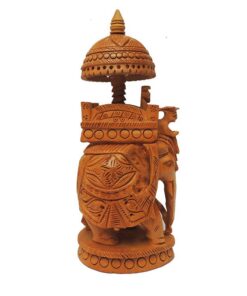 Wooden carved elephant with Ambari canopy and ornate ceremonial details.