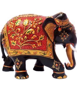 Wooden hand painted elephant figurine with red floral saddle and gold details.