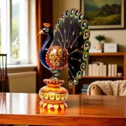 Wooden hand painted peacock with multicolor on a table top