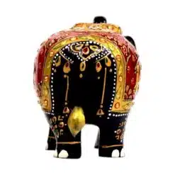 Decorative Indian black elephant figurine with intricate floral patterns, gold accents, and cultural symbolism.