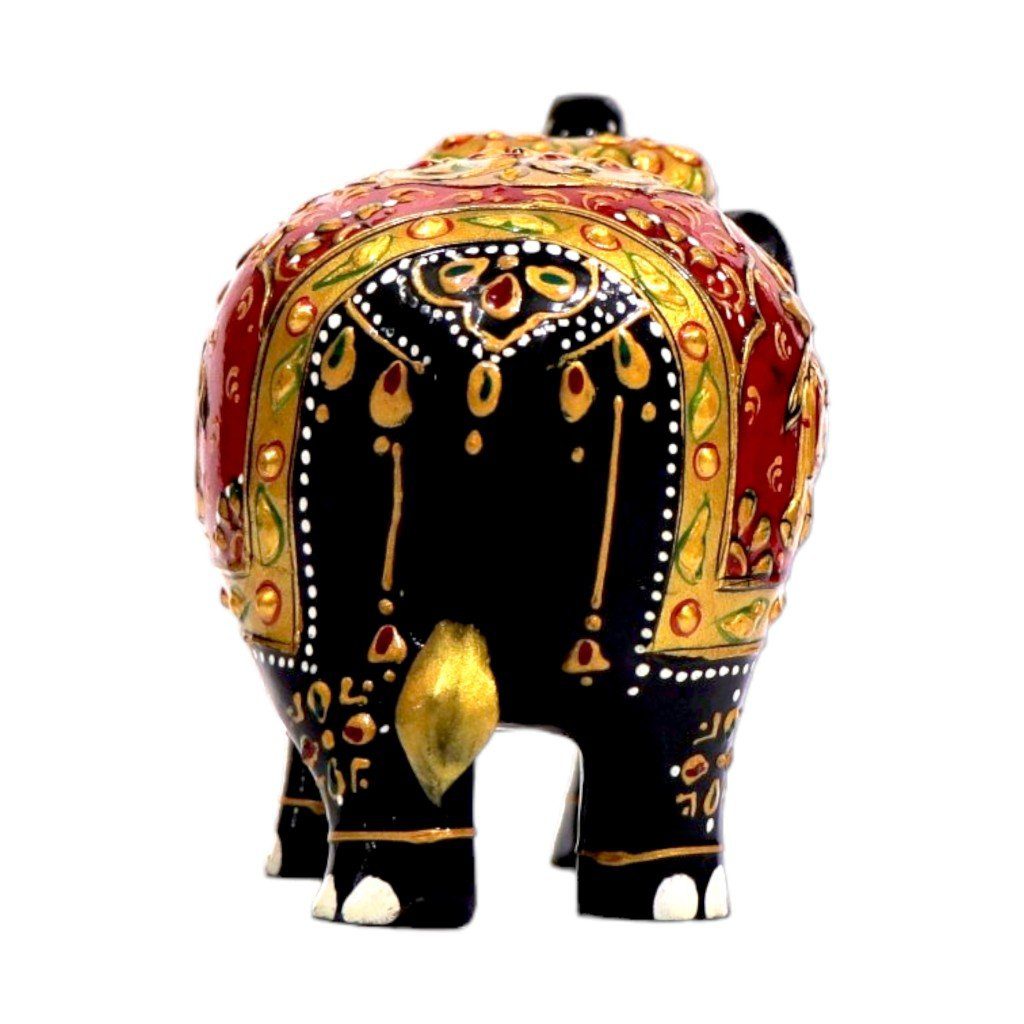 Decorative Indian black elephant figurine with intricate floral patterns, gold accents, and cultural symbolism.