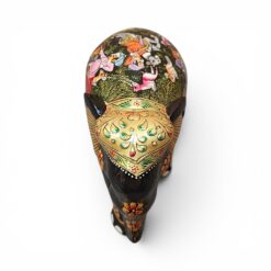 Little wooden elephant figurine with colorful hand-painted floral folk art designs.