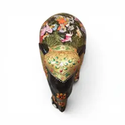 Little wooden elephant figurine with colorful hand-painted floral folk art designs.