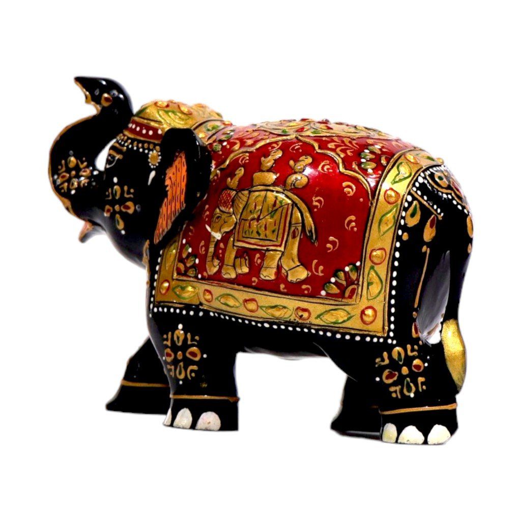 wooden elephant statue trunk up painted