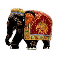 Decorative Indian elephant figurine with black body, colorful patterns, and ornate saddle.
