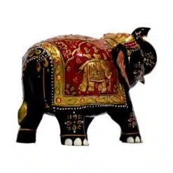 Handcrafted Indian elephant figurine with black body, red saddle, gold accents, and intricate cultural details.
