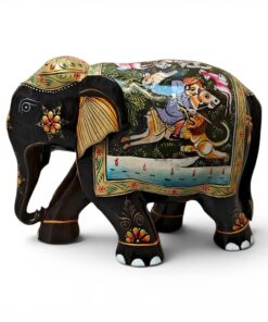 Little wooden elephant figurine with colorful Indian folk art painted details.