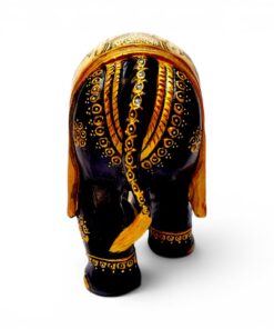 Carved wooden elephant figurine with glossy black finish and gold decorative patterns.