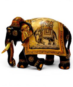 Carved wooden elephant figurine with ornate Indian gold and black painted details.