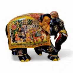 Colorful decorative elephant sculpture with intricate, traditional artwork, regal scene, and vibrant patterns.