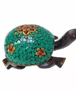 Colorful mosaic turtle sculpture with gold floral accents, wooden body, and vibrant decorative design.
