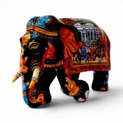 Hand painted wooden elephant figurine with colorful Indian palace artwork.