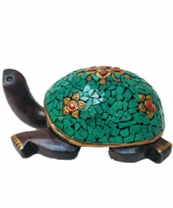 Decorative wooden turtle sculpture with turquoise mosaic shell and gold floral accents for good luck.