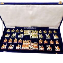 handcrafted chess set in deep blue velvet case with intricate, culturally themed pieces.
