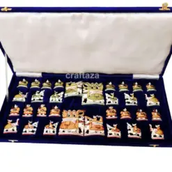 handcrafted chess set in deep blue velvet case with intricate, culturally themed pieces.