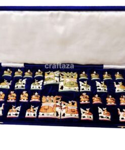 handcrafted chess set in deep blue velvet case with intricate, culturally themed pieces.