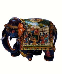 Indian ceremonial elephant figurine with intricate colorful artwork and cultural motifs.