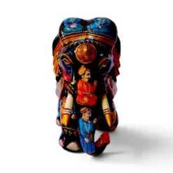 Hand painted wooden elephant figurines featuring colorful Indian folk art details.