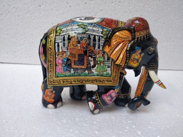 Colorful Indian hand-painted elephant figurine showcasing traditional craftsmanship and cultural storytelling art.