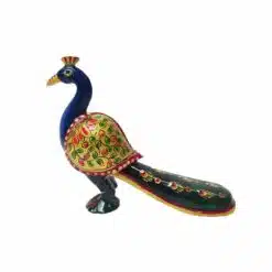 Colorful Indian peacock figurine with golden wings, ornate tail.