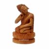 Hand-carved wooden Buddha statue with lotus symbolizing peace and spiritual enlightenment.