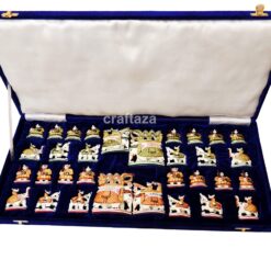 handcrafted chess set in deep blue velvet case with intricate, culturally themed pieces.