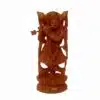 Wooden Krishna statue playing flute with ornate attire and intricate carvings.