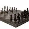 Elegant bronze chess set on ornate board, perfect for art, decor, and strategic gameplay.
