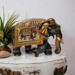 Decorative Indian ceramic elephant figurine with intricate traditional designs and vibrant colors.