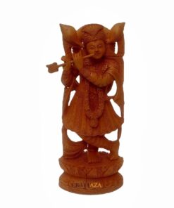 Wooden Krishna statue playing flute with ornate attire and intricate carvings.
