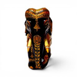 Carved wooden elephant figurine with ornate gold and red painted details.