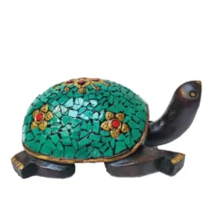 wooden turtle statue with stone work on it