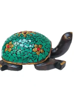 wooden turtle statue with stone work on it