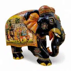 Decorative Indian-style black elephant figurine with detailed paintings, gemstones, floral motifs, and cultural symbolism.