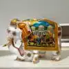 White wood elephant statue miniature painted on right side of elephant