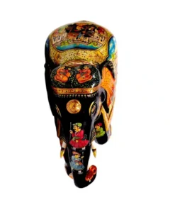 wooden elephant trunk down with men figure painted on elephant and head