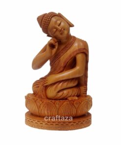 Hand-carved wooden Buddha statue with lotus symbolizing peace and spiritual enlightenment.