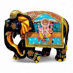 Wooden elephant with Ganesh figure painted on right side of elephant statue